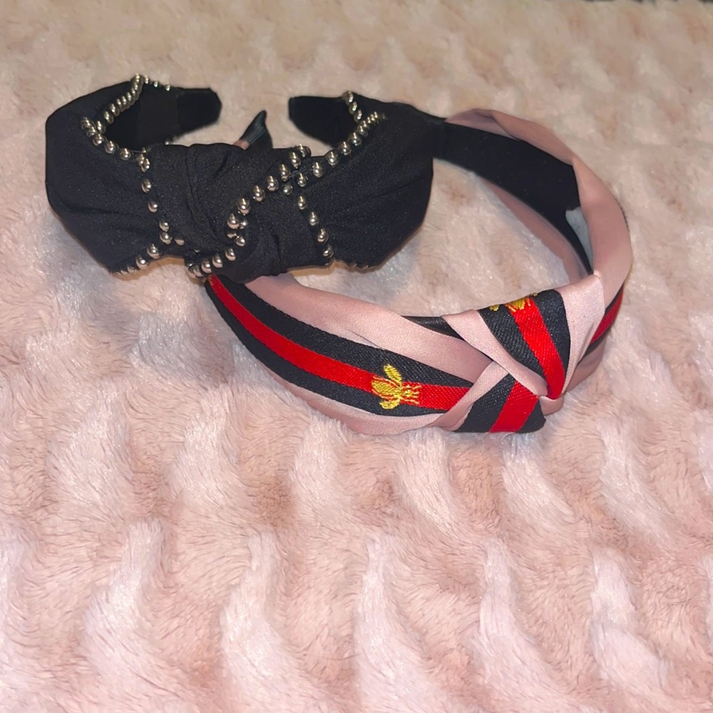 2 stylish unworn top knot headbands. One is studded and the other is whimsical.